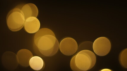 Natural Gold Color Bokeh Particles Effect Photo Overlays Background Glowing Abstract Lens Lights Defocused Circles and Blur Golden Glitter Beautiful Glamour Style. Use Screen Overlay Mode.