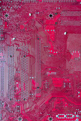 Pink computer circuit board. Hardware components. Close-up, background