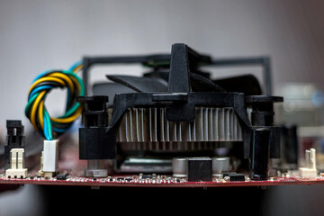 Side view of PCU cooler connected to the motherboard. Close-up view, background idea concept