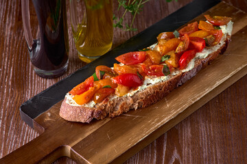 Caprese bruschetta toasts with cherry tomatoes, mozzarella and basil.