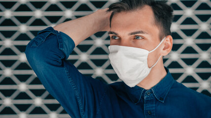 close up. a modern young man in a protective mask