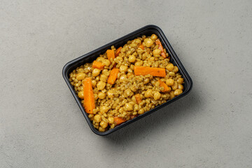 Vegetarian pilaf in a biodegradable shipping container