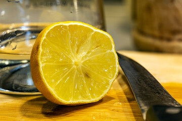 Yellow lemon cut with a knife. Macro