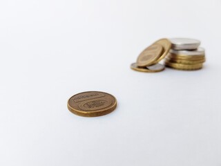 Belarusian coins on a white background of copper and alloys of metals. Folded with a stack. Saving. Stock for a rainy day.