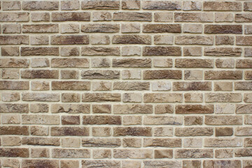 Background of horizontal bricks of brown and sand color.