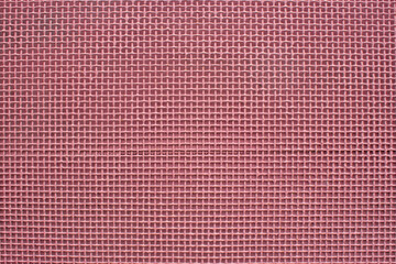Pink metal background in the form of square cells.