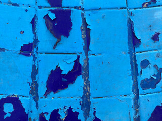 painted blue tile with peeled paint