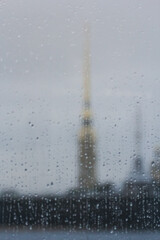 View of the Peter and Paul Fortress through wet glass.