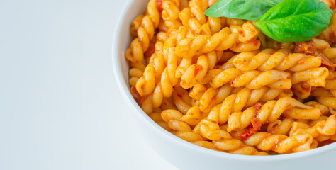 Homemade fresh Italian food with gemelli traditional pasta noodle with bolognese red rosso pesto sauce made from healthy organic tomato spice chili vegan cook recipe