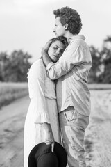 Young couple standing on countryroad