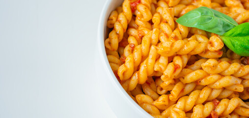 Homemade fresh Italian food with gemelli traditional pasta noodle with bolognese red rosso pesto sauce made from healthy organic tomato spice chili vegan cook recipe