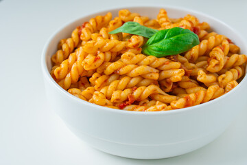 Homemade fresh Italian food with gemelli traditional pasta noodle with bolognese red rosso pesto sauce made from healthy organic tomato spice chili vegan cook recipe