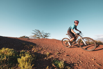 Fototapeta na wymiar mountain biker riding on a single track