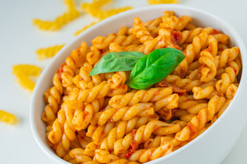 Homemade fresh Italian food with gemelli traditional pasta noodle with bolognese red rosso pesto sauce made from healthy organic tomato spice chili vegan cook recipe