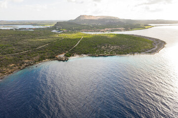 Aerial view of coast of Curaçao in the Caribbean Sea with turquoise water, cliff, beach and...