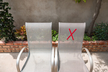 Social distancing rules in practice, alternate seating in the park area, to avoid spreading the...