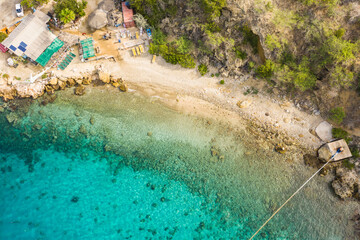 Aerial view of coast of Curaçao in the Caribbean Sea with turquoise water, cliff, Tugboat beach...