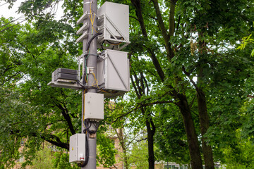 Metal boxes for placing mobile communications equipment on an iron pole