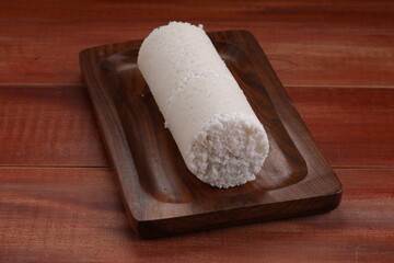 White raw rice Puttu or Pittu_wooden background