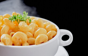 Close up of cooked macaroni pasta and vegan cheese sauce