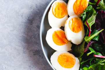salad with arugula, spinach, tomatoes and eggs. tinting. selective focus
