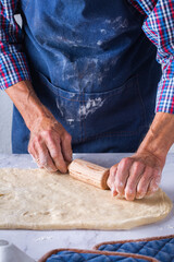 Baking at home concept. Senior man hands cooking, making dough