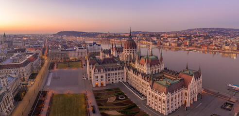 Panoramic aerial drone shot of Dome of Hungarian Parliament at dawn before sunrise in Budapest morning