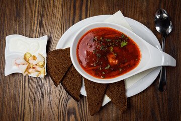 Ukrainian borsch with bacon and dark bread