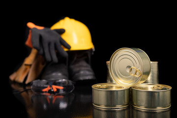 Fototapeta premium Metal cans with food. Work clothes and food for the production worker.