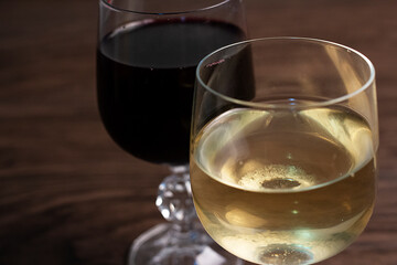Glasses of wine on the table, red wine and white wine.