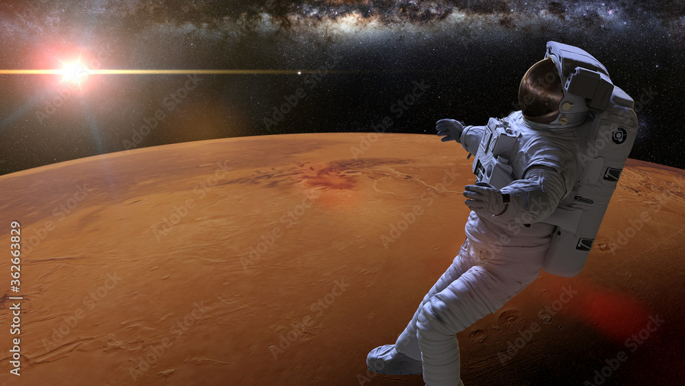 Wall mural astronaut during a space walk in orbit of planet mars