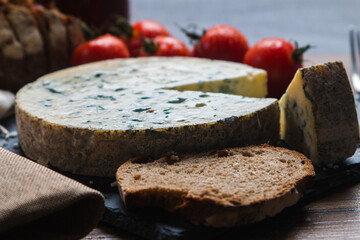 Fourme d'ambert cheese and bread with cherry tomato