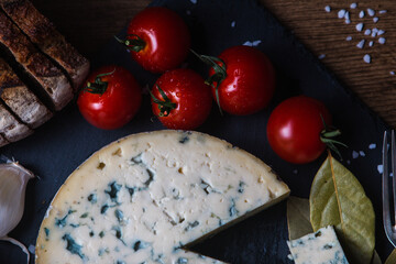 Fourme d'ambert cheese and bread with cherry tomato