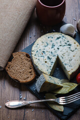 Fourme d'ambert cheese and bread with cherry tomato