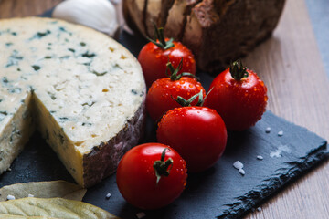 Fourme d'ambert cheese and bread with cherry tomato