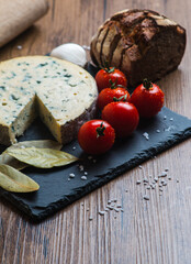 Fourme d'ambert cheese and bread with cherry tomato