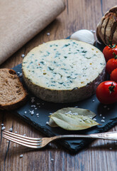 Fourme d'ambert cheese and bread with cherry tomato