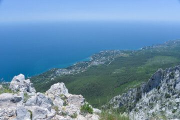 on a high mountain you can see the entire beach and coast during the day in summer