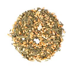 Japanese green tea Genmaicha, isolated on white background. Tea leaves with roasted brown rice. Organic tea. Top view. Close up.