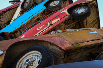 Stack of old cars, closeup bottom view