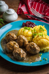 Meatballs with potatoes in dill sauce.