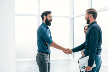 young entrepreneurs shaking hands with each other