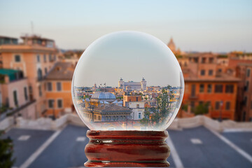 Early morning view of Rome from the Spanish Steps through a glass transparent ball
