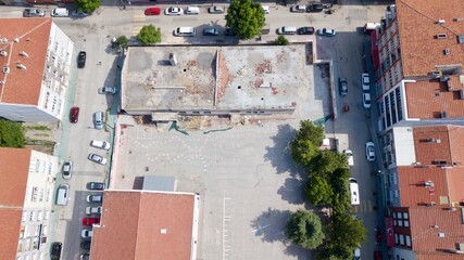 Aerial view of destroyed school building in the city center.