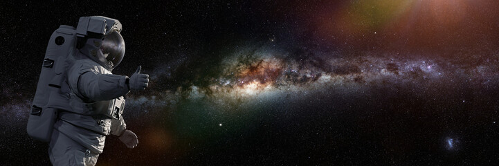 astronaut showing thumbs up during spacewalk, background banner