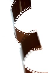 An abstract coil of photographic film on a light box 