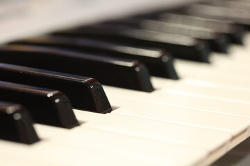 Fototapeta na wymiar row of black and white piano keys on a Piano keyboard.