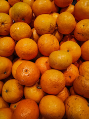 A group of Mandarin oranges on the basket at supermarket