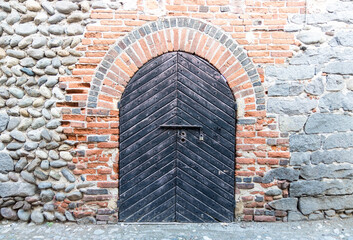 Original medieval wooden door; photo taken in Italy