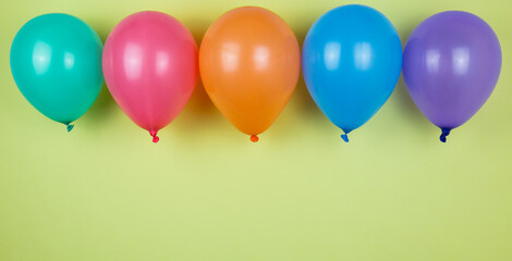 Different colors of balloons. Balloons on a yellow background